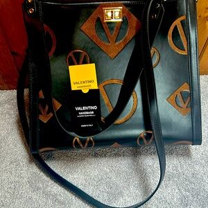 Black and gold V Valentino tote.